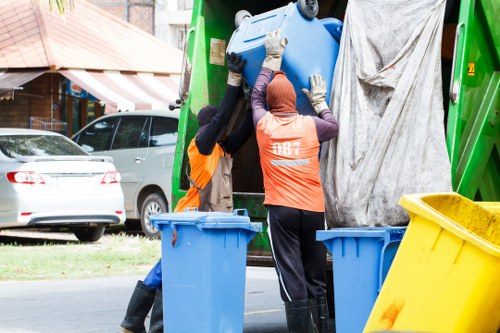 Professional waste clearance team managing construction debris